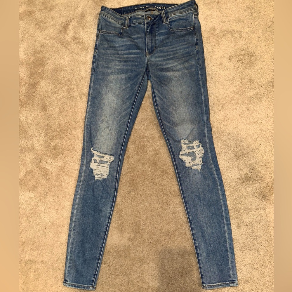 American Eagle “mid-rise jeggings” ripped skinny jeans